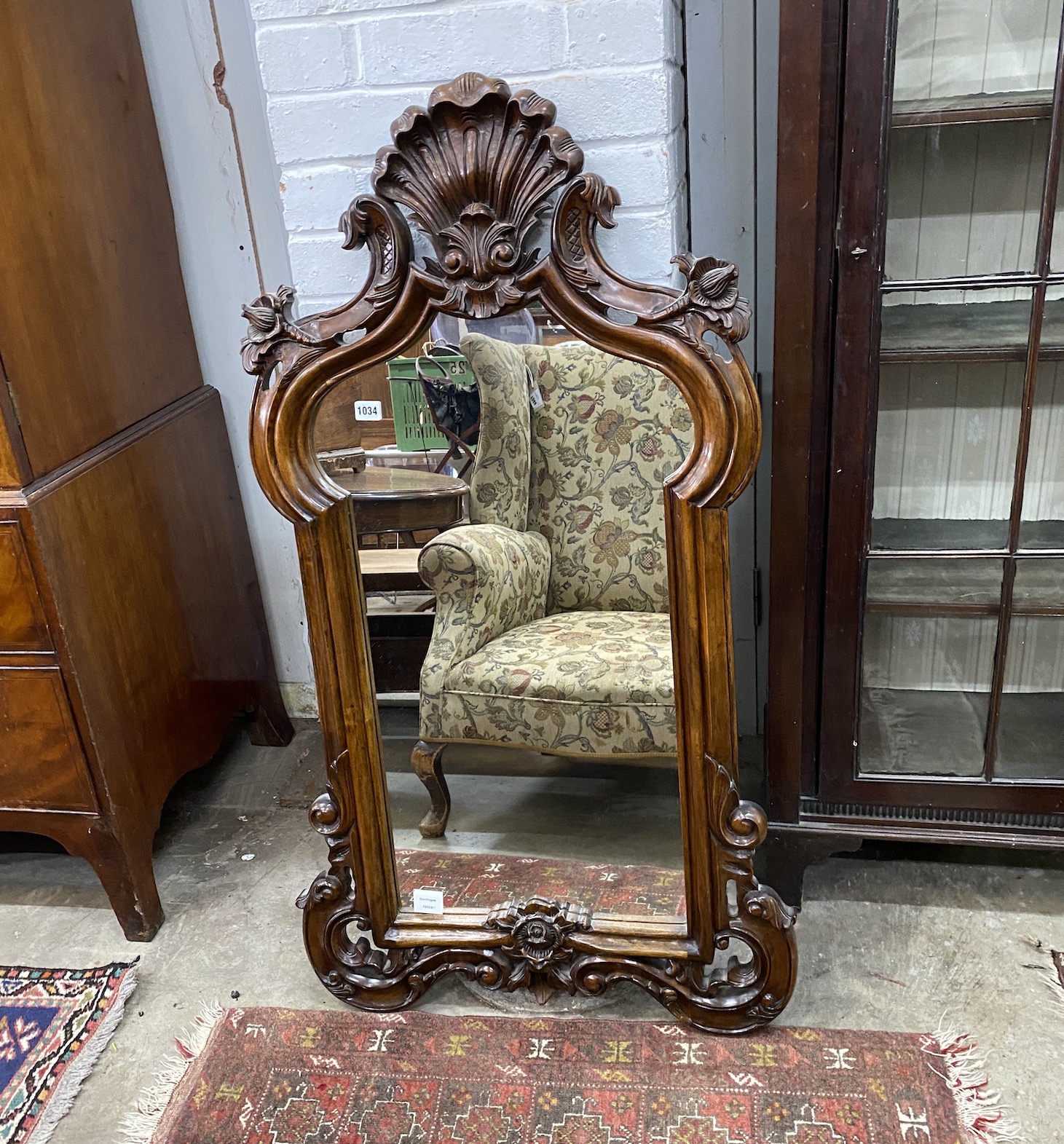 A Victorian style carved mahogany wall mirror, width 63cm, height 120cm